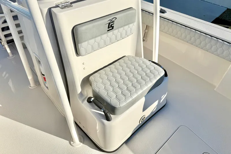 Slide: The Image of 2026 Carolina Skiff 24 Ultra Elite boat seat with hexagonal pattern upholstery. - 21