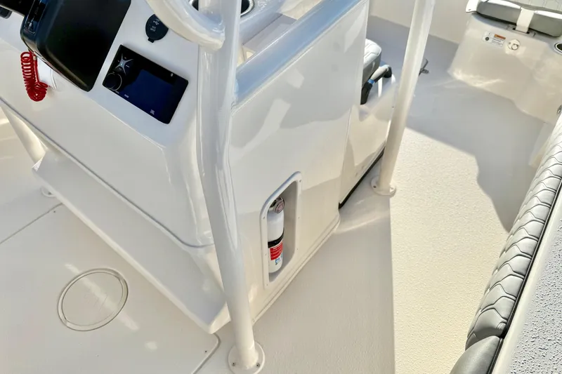 Slide: The Image of 2026 Carolina Skiff 24 Ultra Elite boat interior with console and seating. - 25