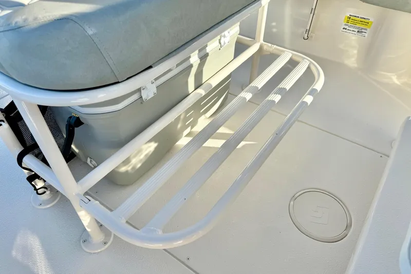Slide: The Image of 2026 Carolina Skiff 24 Ultra Elite boat interior with seating and storage area. - 27