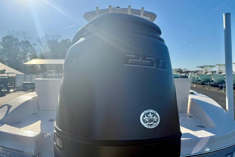 Slide: The Image of 2026 Carolina Skiff 24 Ultra Elite boat with powerful 250 engine in sunlight. - 3