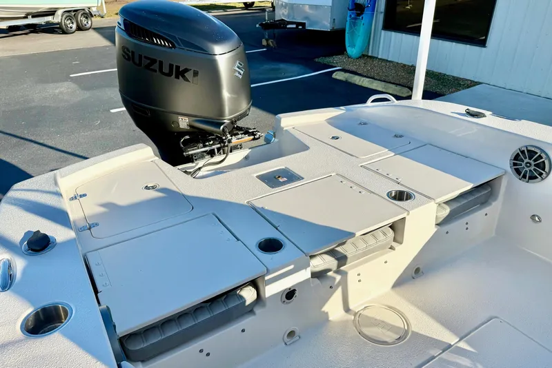 Slide: The Image of 2026 Carolina Skiff 24 Ultra Elite boat with Suzuki outboard motor, featuring spacious deck layout. - 35