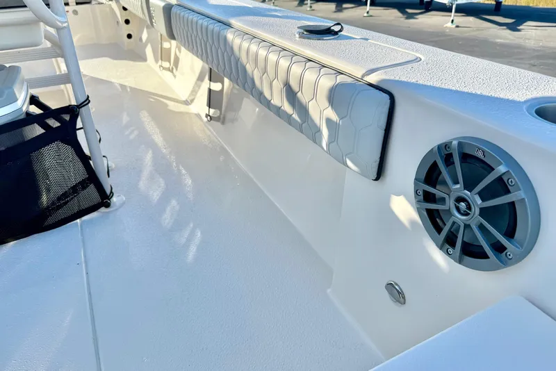 Slide: The Image of 2026 Carolina Skiff 24 Ultra Elite boat interior with seating and speaker system. - 40