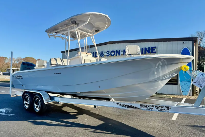 Slide: The Image of 2026 Carolina Skiff 24 Ultra Elite boat on trailer at dealership. - 5