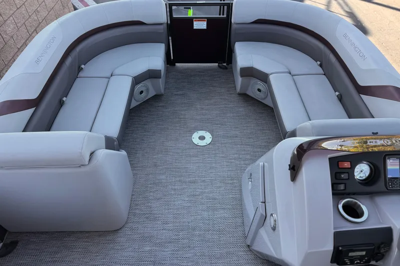Slide: The Image of 2023 Bennington 22 XSR pontoon boat interior with plush seating and modern dashboard. - 10
