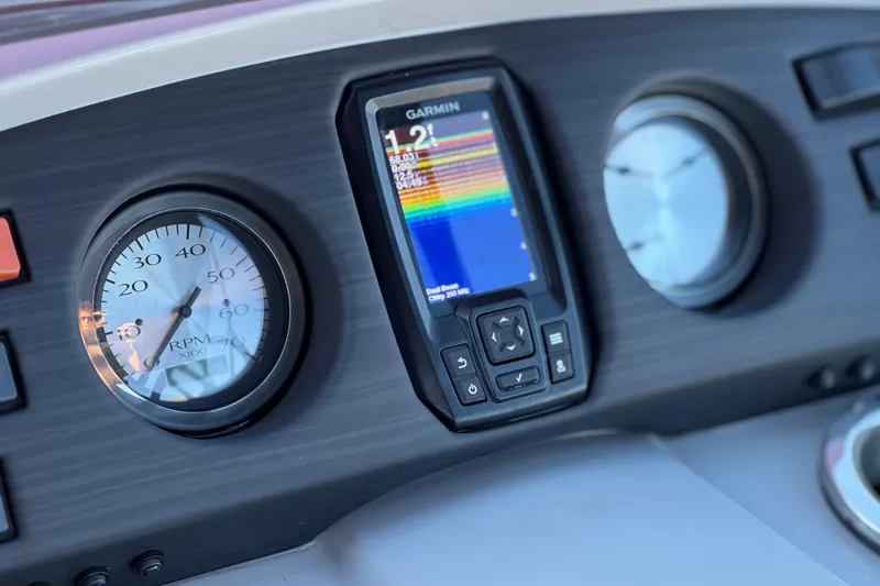 Slide: The Image of Dashboard of 2023 Bennington 22 XSR with Garmin display and RPM gauge. - 23