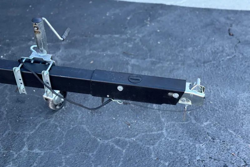 Slide: The Image of Trailer hitch of a 2023 Bennington 22 XSR on a paved surface. - 26