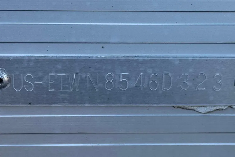 Slide: The Image of 2023 Bennington 22 XSR boat hull identification number on metal plate. - 28