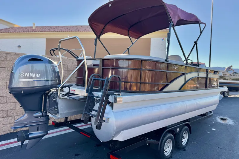 Slide: The Image of 2023 Bennington 22 XSR pontoon boat with Yamaha engine on trailer. - 6