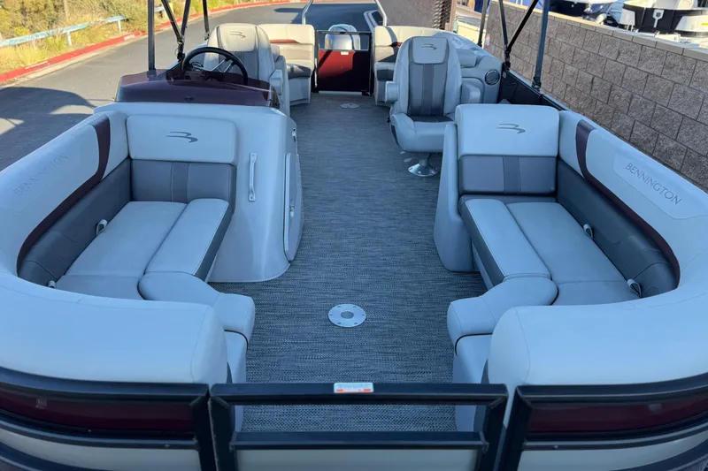 Slide: The Image of 2023 Bennington 22 XSR pontoon boat interior with plush seating and modern design. - 9