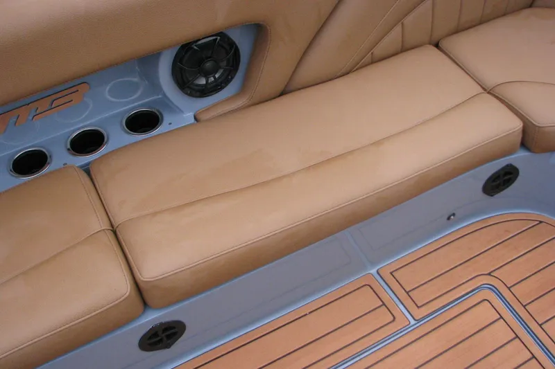 Slide: The Image of Luxurious tan seating and teak flooring in 2026 MB B52-23 Classic LIMITED boat. - 13