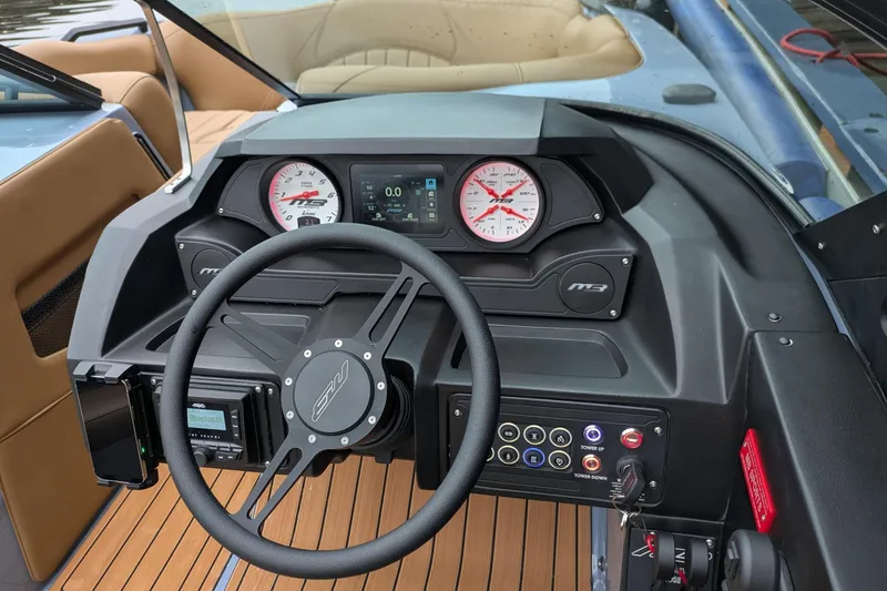 Slide: The Image of 2026 MB B52-23 Classic LIMITED boat dashboard with modern controls and wood accents. - 24