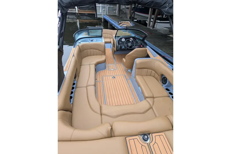 Slide: The Image of 2026 MB B52-23 Classic LIMITED boat interior with tan leather seating and wood accents. - 27