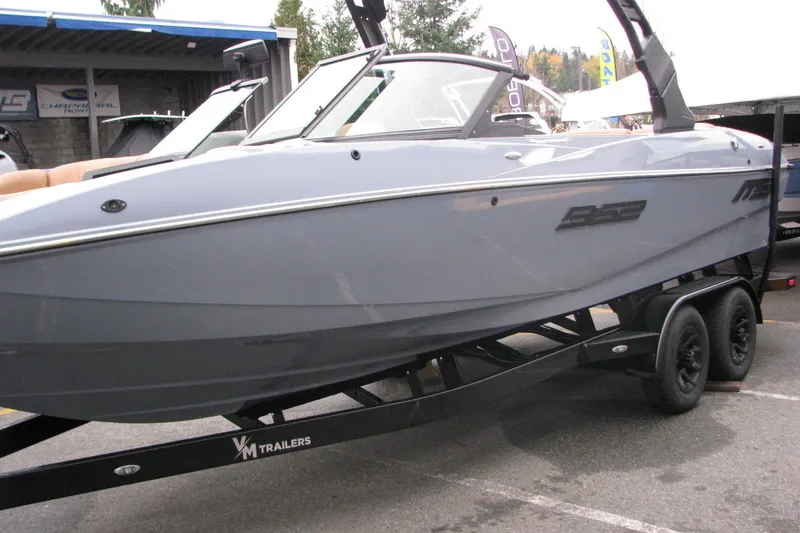 Slide: The Image of 2026 MB B52-23 Classic LIMITED boat on trailer, sleek design, outdoor display. - 3