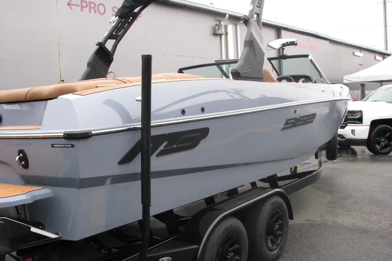 Slide: The Image of 2026 MB B52-23 Classic LIMITED boat on trailer, sleek design, outdoor display. - 4