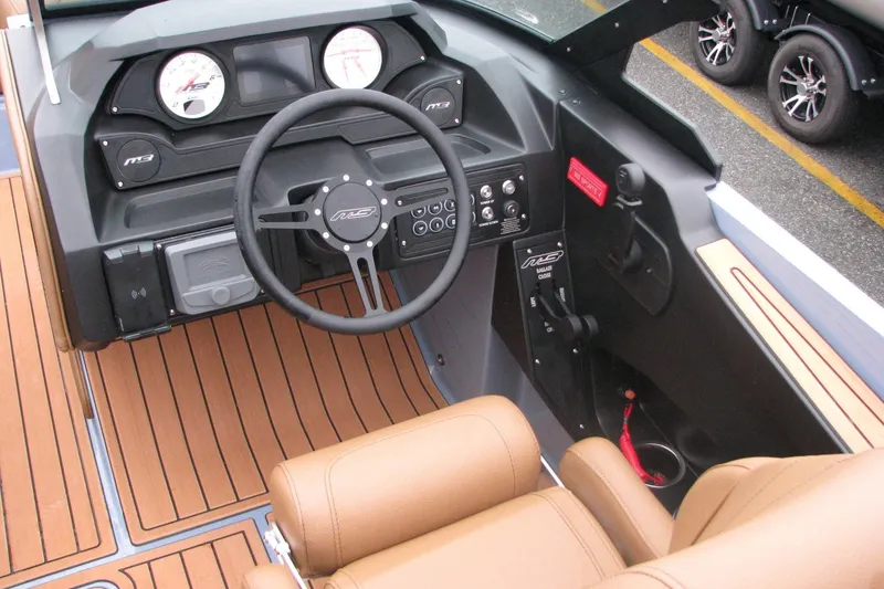 Slide: The Image of 2026 MB B52-23 Classic LIMITED boat interior with modern dashboard and tan seating. - 6