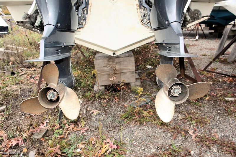 Slide: The Image of Twin propellers of a 2013 Pursuit ST 310 Sport boat on dry land. - 40