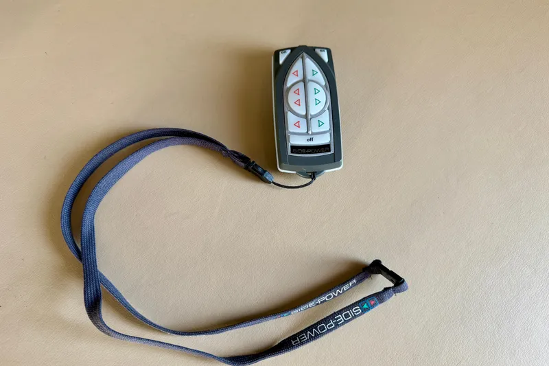 Slide: The Image of 2004 Meridian 490 Pilothouse helm with steering wheel, controls, and navigation equipment. - 20