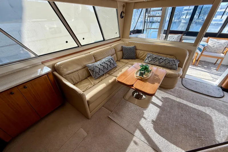 Slide: The Image of Luxurious interior of 2004 Meridian 490 Pilothouse yacht with elegant seating and modern amenities. - 29