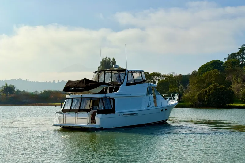 Slide: The Image of 2004 Meridian 490 Pilothouse Yacht on calm water. - 3