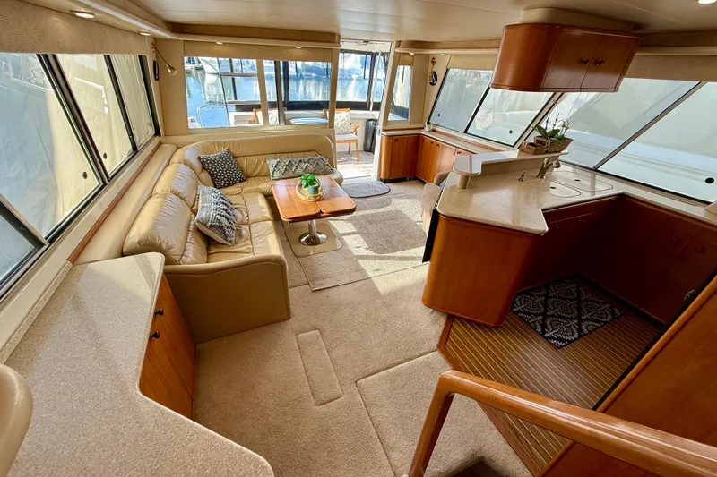 Slide: The Image of Luxurious interior of 2004 Meridian 490 Pilothouse yacht with cozy seating and modern amenities. - 30