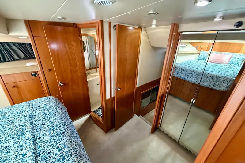 Slide: The Image of Luxurious bedroom in 2004 Meridian 490 Pilothouse yacht with elegant wood finishes. - 40
