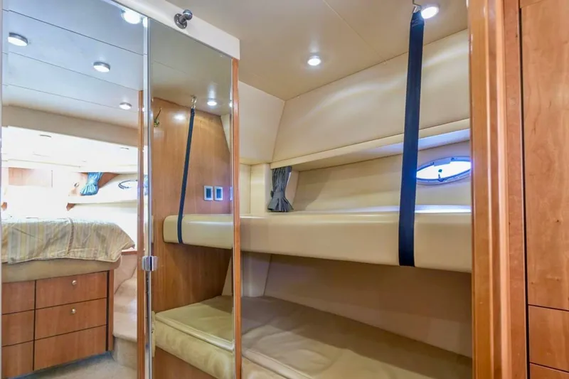 Slide: The Image of Cozy cabin interior of 2004 Meridian 490 Pilothouse with bed and portholes. - 46