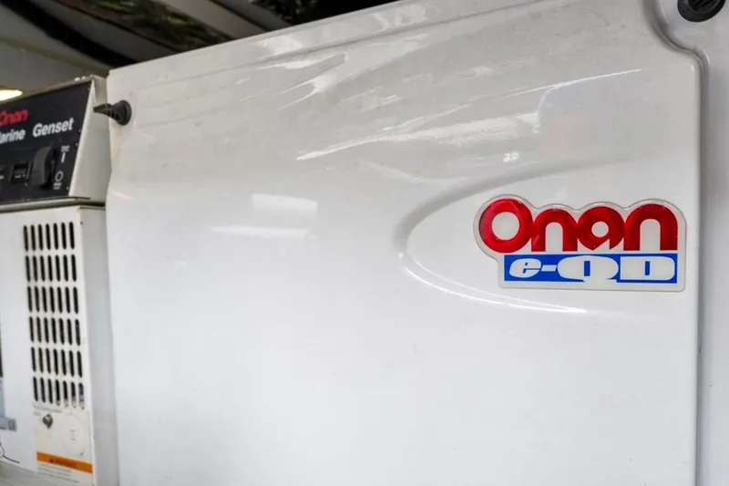 Slide: The Image of 2004 Meridian 490 Pilothouse boat deck with stainless steel railings by calm marina. - 54