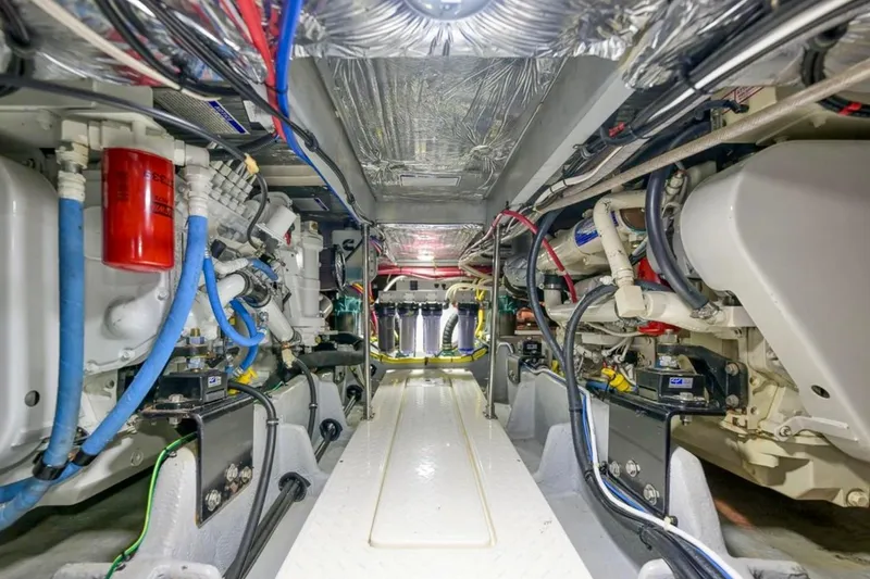 Slide: The Image of Control panels on a 2004 Meridian 490 Pilothouse boat, featuring Victron Energy charger and US Watermaker. - 55