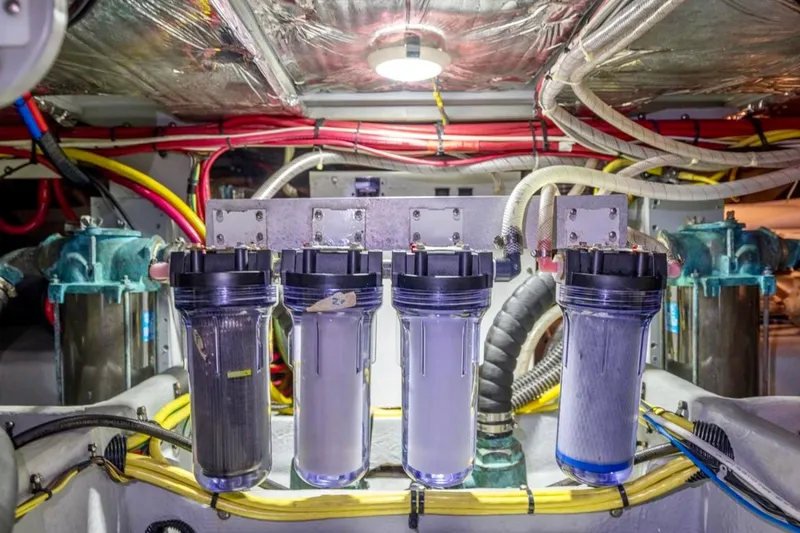 Slide: The Image of Engine room of 2004 Meridian 490 Pilothouse with visible machinery and components. - 59