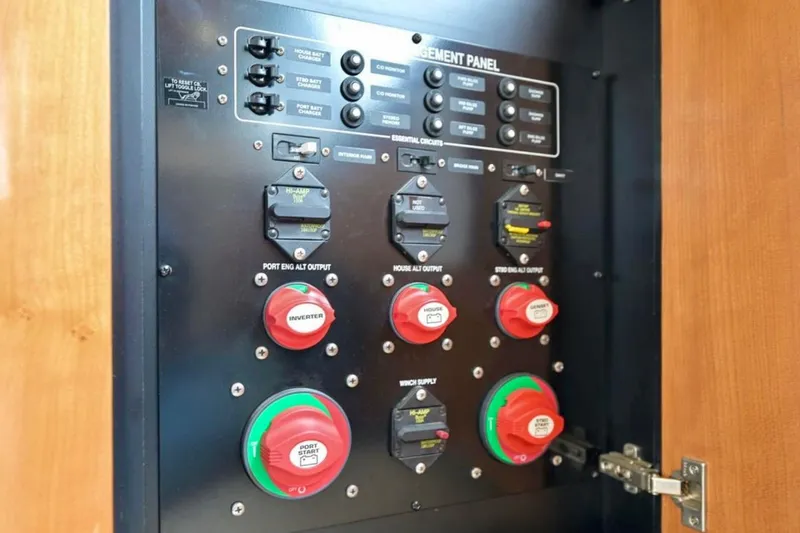 Slide: The Image of Electrical control panel of a 2004 Meridian 490 Pilothouse boat. - 63