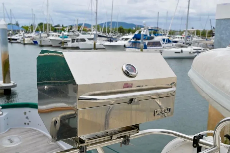 Slide: The Image of Stainless steel grill on a 2004 Meridian 490 Pilothouse yacht in a marina. - 65