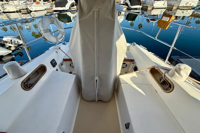 Slide: The Image of Cockpit of a 1988 Catalina 36 sailboat docked at a marina. - 12