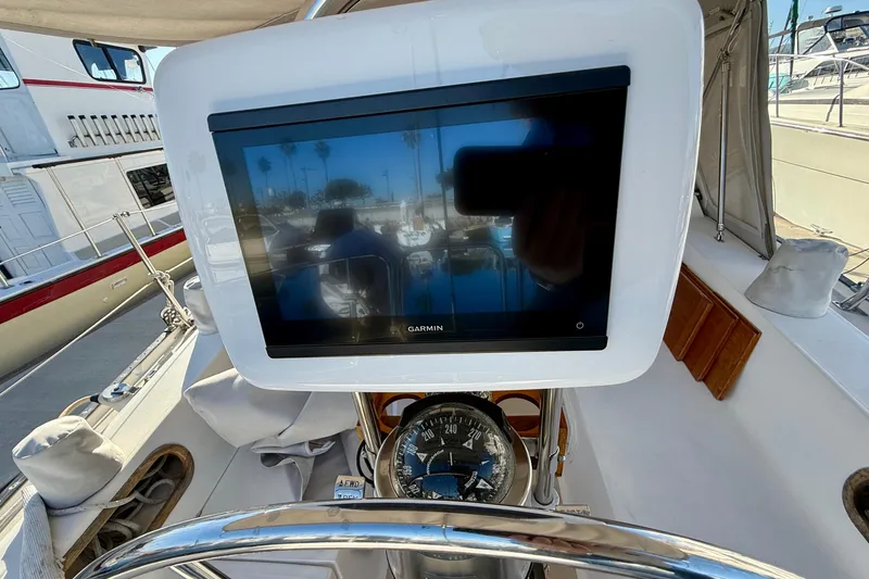 Slide: The Image of Cockpit of 1988 Catalina 36 sailboat with Garmin navigation display and compass. - 14