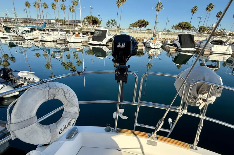 Slide: The Image of Catalina 36 sailboat in marina, 1988 model, with lifebuoy and outboard motor. - 17