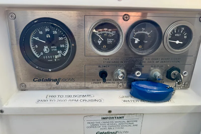 Slide: The Image of Control panel of a 1988 Catalina 36 yacht with gauges and switches. - 18