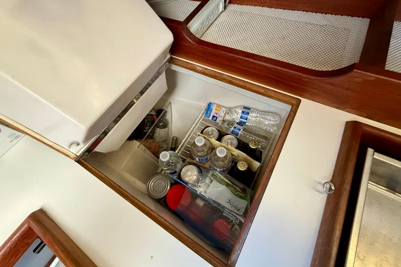 Slide: The Image of Built-in cooler on 1988 Catalina 36 yacht, stocked with drinks and canned goods. - 32