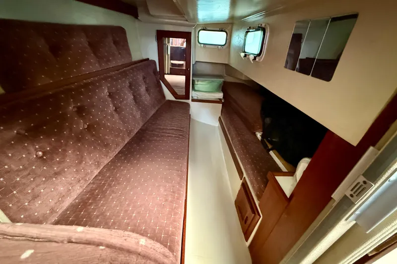 Slide: The Image of Interior of 1988 Catalina 36 sailboat with cozy seating and wooden accents. - 33