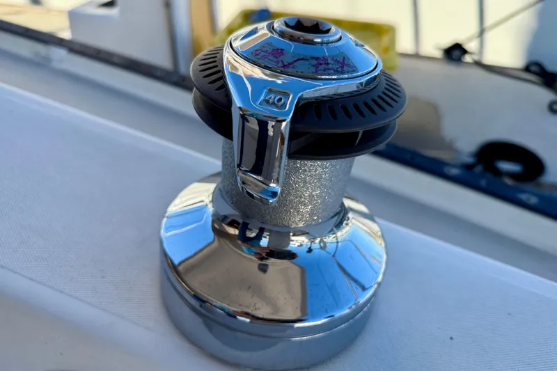 Slide: The Image of Chrome winch on a 1988 Catalina 36 sailboat deck. - 6