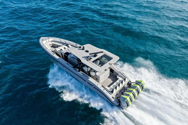 Slide: The Image of 2022 Midnight Express 43' Solstice boat cruising on open water. - 10