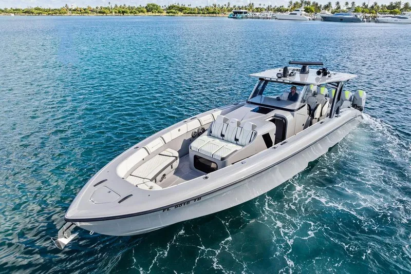 Slide: The Image of 2022 Midnight Express 43' Solstice boat cruising on clear blue water. - 15