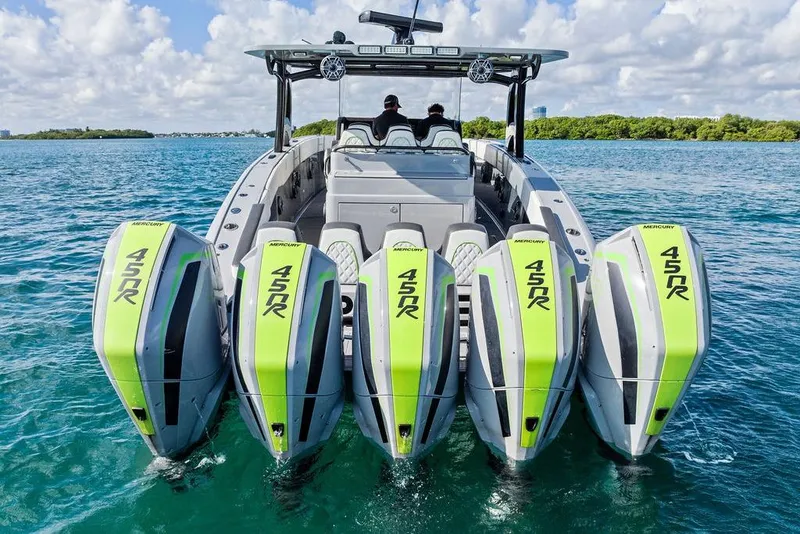 Slide: The Image of 2022 Midnight Express 43' Solstice boat with five Mercury 450R engines on open water. - 16