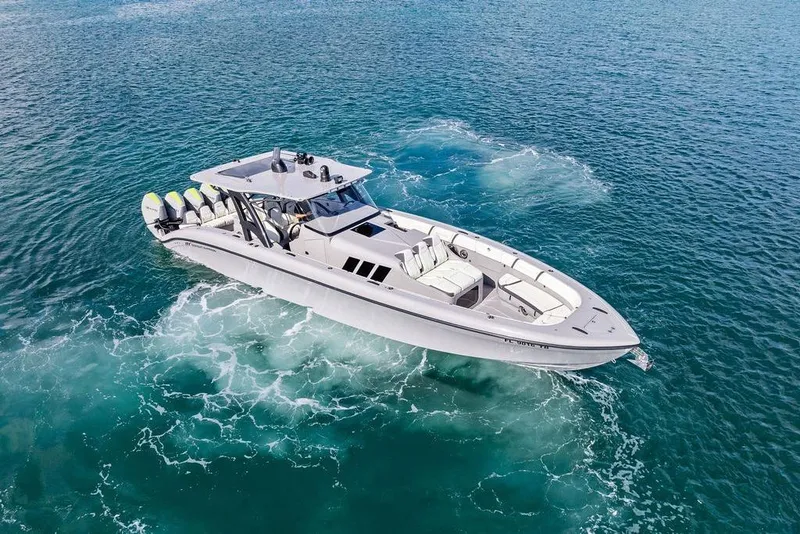 Slide: The Image of 2022 Midnight Express 43' Solstice boat cruising on clear blue ocean waters. - 17