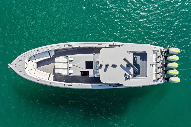 Slide: The Image of Aerial view of 2022 Midnight Express 43' Solstice boat on turquoise water. - 21