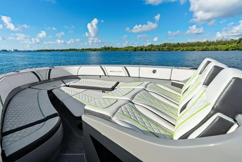 Slide: The Image of Luxurious seating on 2022 Midnight Express 43' Solstice boat, with scenic water view. - 22