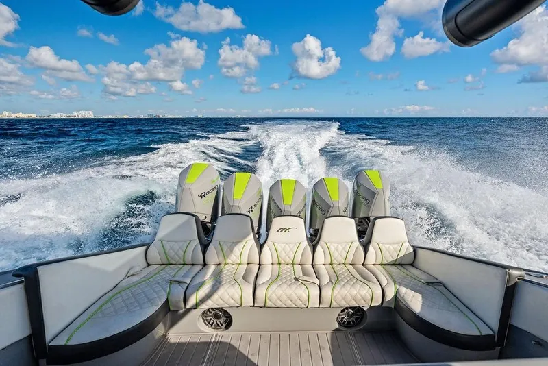 Slide: The Image of 2022 Midnight Express 43' Solstice boat cruising on open ocean with powerful engines. - 28