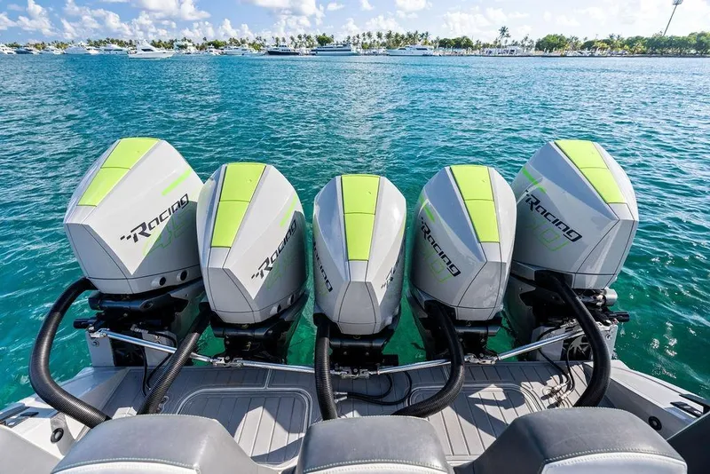 Slide: The Image of Four powerful outboard engines on a 2022 Midnight Express 43' Solstice boat. - 31