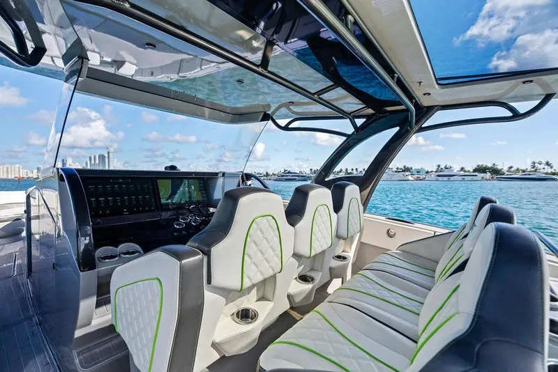 Slide: The Image of Interior of 2022 Midnight Express 43' Solstice boat with luxury seating and ocean view. - 36