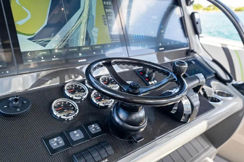 Slide: The Image of Dashboard of 2022 Midnight Express 43' Solstice boat with advanced navigation controls. - 40