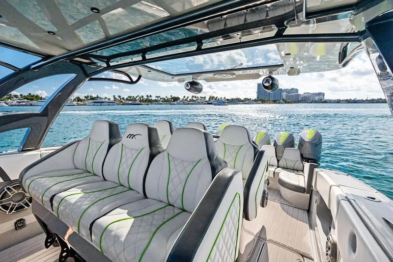 Slide: The Image of Luxurious 2022 Midnight Express 43' Solstice boat interior with plush seating on open water. - 41