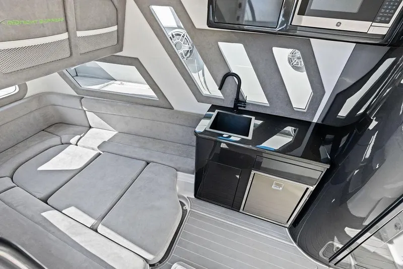 Slide: The Image of Luxurious interior of 2022 Midnight Express 43' Solstice yacht with modern kitchenette and seating. - 42